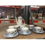 A VINTAGE COFFEE SET IN A PLAE BLUE AND WHITE WITH FOLIAGE DECORATION TO INCLUDE COFFEE POT, CREAM