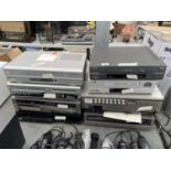 AN ASSORTMENT OF ITEMS TO INCLUDE A PROLINE VHS/DVD PLAYER, A BUSH DVD RECORDER AND FURTHER VHS