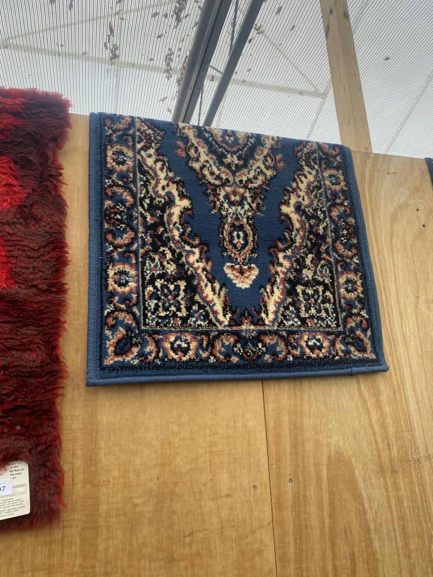 A MODERN RED RUG (30"X54") AND A BLUE PATTERNED RUG - Image 3 of 3