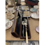 A BOXED VINTAGE FISH KNIFE AND FORK SET PLUS A BOX CONTAINING A SERVING SET