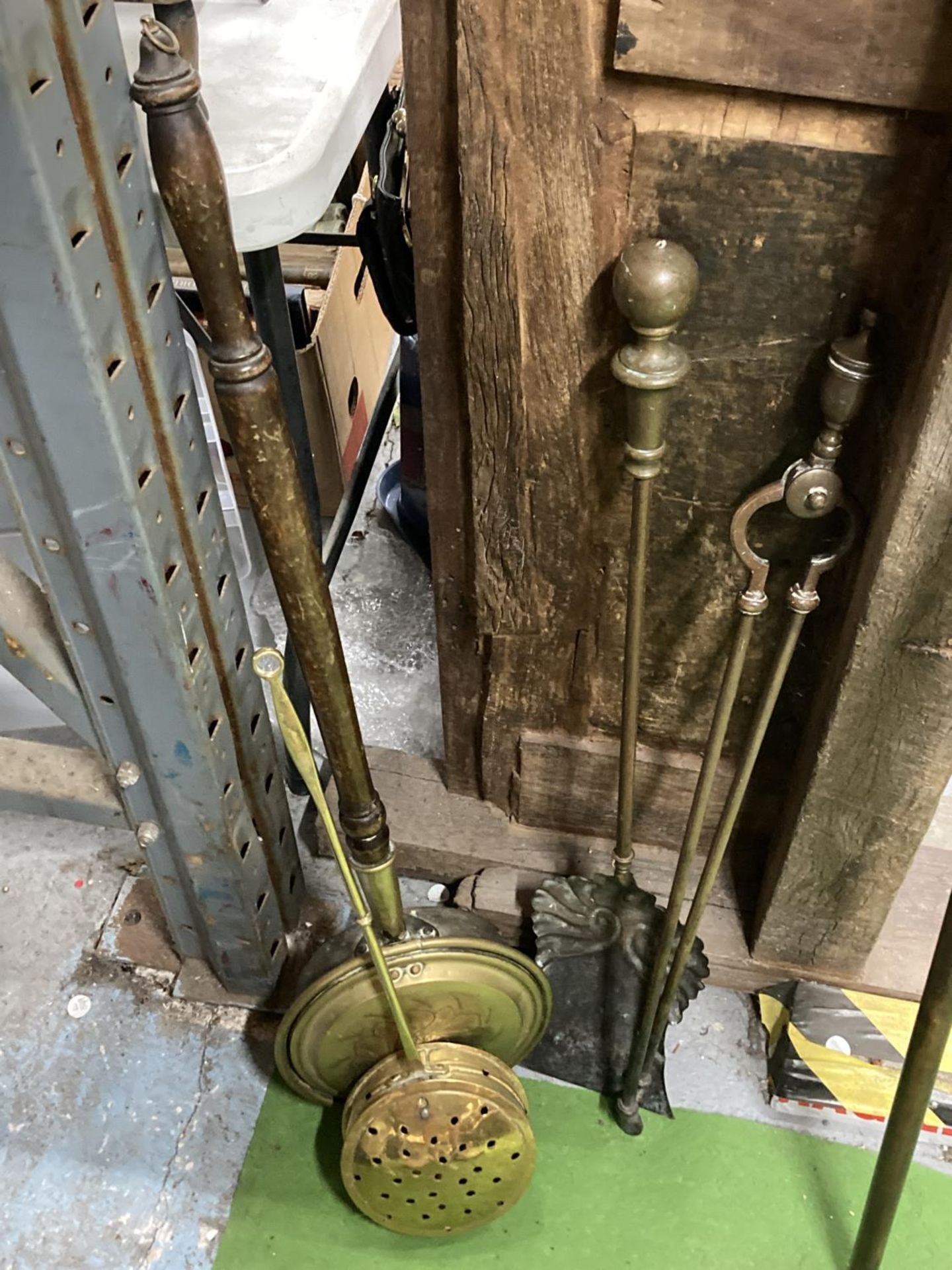 A COPPER AND BRASS BED WARMING PAN, FIRE TONGS, SHOVEL AND A BRASS CHESTNUT ROASTING PAN