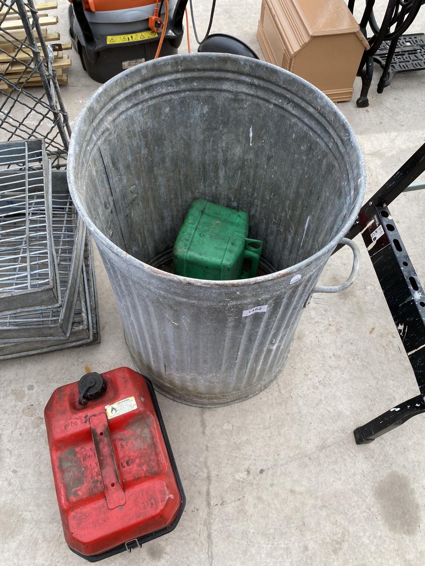 A GALVANISED DUST BIN AND A METAL FUEL CAN