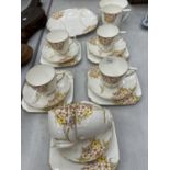 A QUANTITY OF T & K LONGTON, KENT CHINA TEAWARE TO INCLUDE TRIOS, CREAM JUG, SUGAR BOWL AND SANDWICH