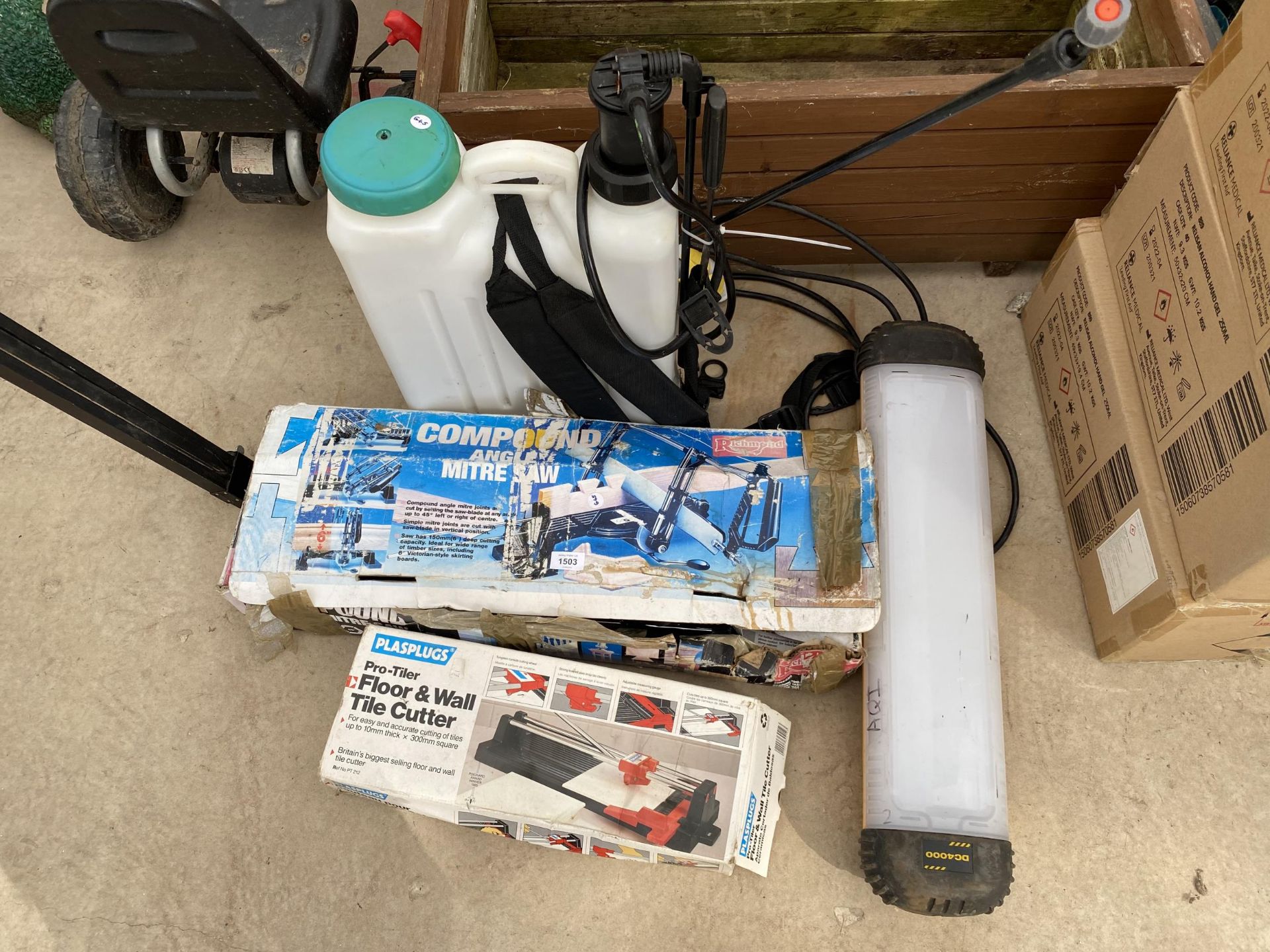 A MITRE SAW, A TILE CUTTER, A WORK LIGHT AND A GARDEN SPRAYER