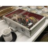 A LOCKABLE ALUMINIUM CASE CONTAINING A QUANTITY OF COSTUME JEWELLERY TO INCLUDE NECKLACES, BEADS,