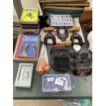 AN ASSORTMENT OF ITEMS TO INCLUDE DVDS, SUN GLASSES AND GUN SUPPORTS ETC