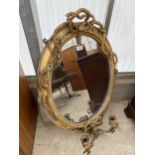 AN ELABORATE VICTORIAN GILT FRAMED MIRROR WITH ROPE DESIGN AND LOWER CANDLE HOLDERS