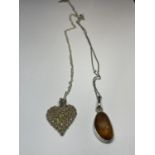 TWO MARKED SILVER NECKLACES WITH PENDANTS TO INCLUDE A FLOWER HEART AND AN AMBER STYLE