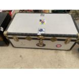 A METAL AND BANDED STORAGE TRUNK