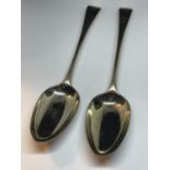 A PAIR OF MARKED SILVER SERVING SPOONS