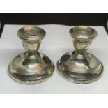 A PAIR OF HALLMARKED BIRMINGHAM SILVER CANDLESTICKS