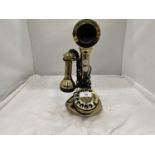 A VINTAGE STYLE BRASS COLOURED CANDLESTICK TELEPHONE