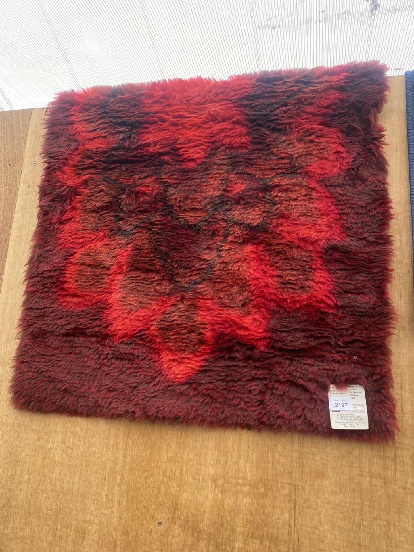 A MODERN RED RUG (30"X54") AND A BLUE PATTERNED RUG - Image 2 of 3
