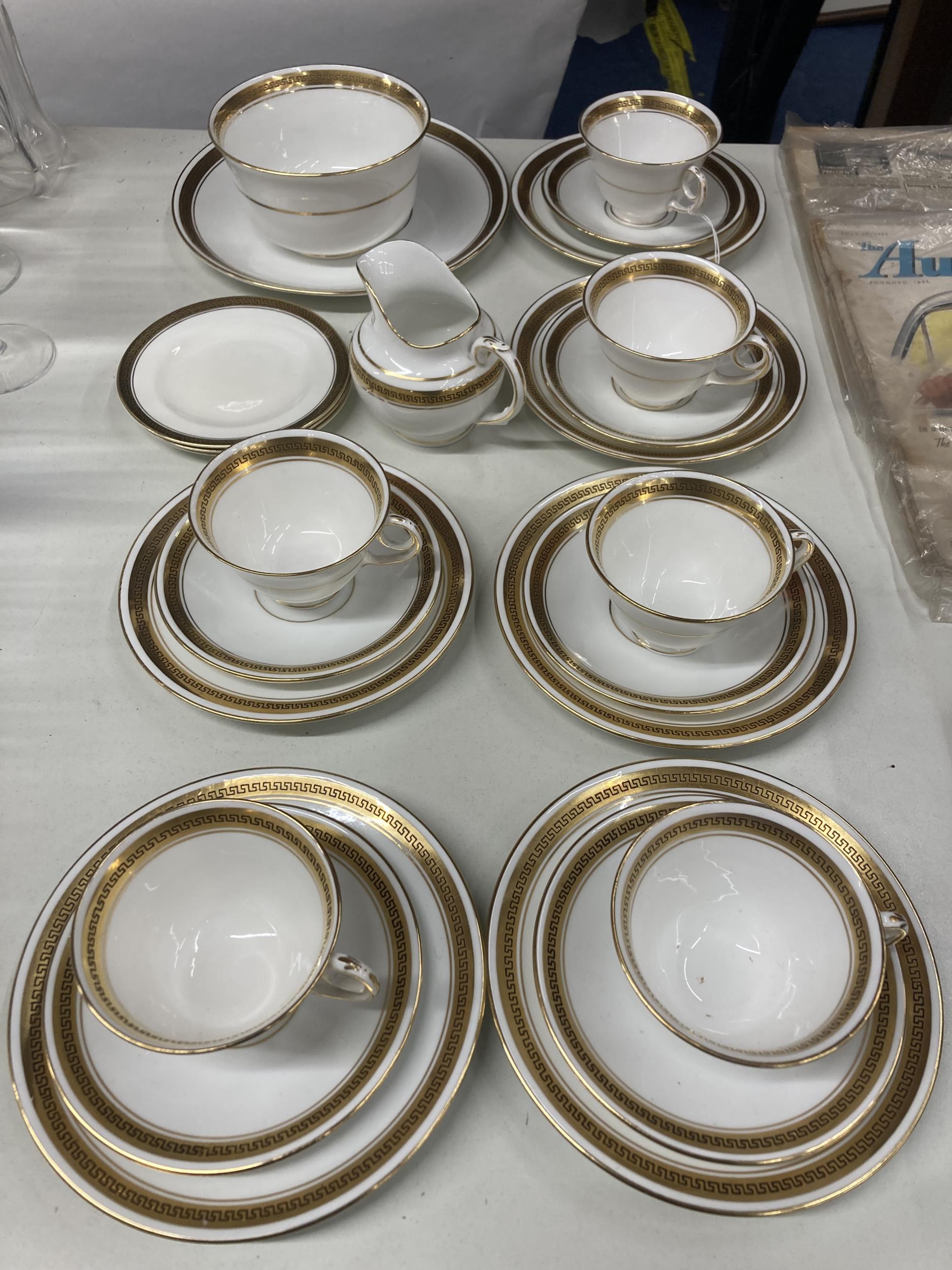 A DIAMOND CHINA WHITE AND GILT PART TEASET TO INCLUDE CUPS, SAUCERS, PLATES, CREAM JUG, BOWL, ETC