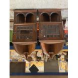 A PAIR OF EDWARDIAN MAHOGANY ASTRAGAL GLAZED CORNER CABINETS WITH CARVED ARCHED TOPS AND LOCKING