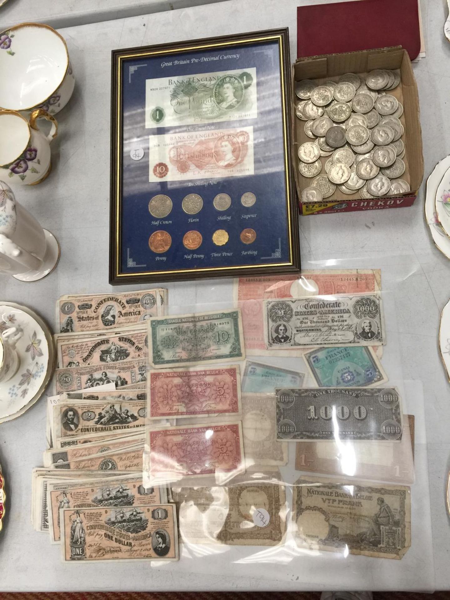 A QUANTITY OF VINTAGE U.S.A., BELGIUM AND FRENCH BANK NOTES PLUS A COLLECTION OF TWO SHILLING