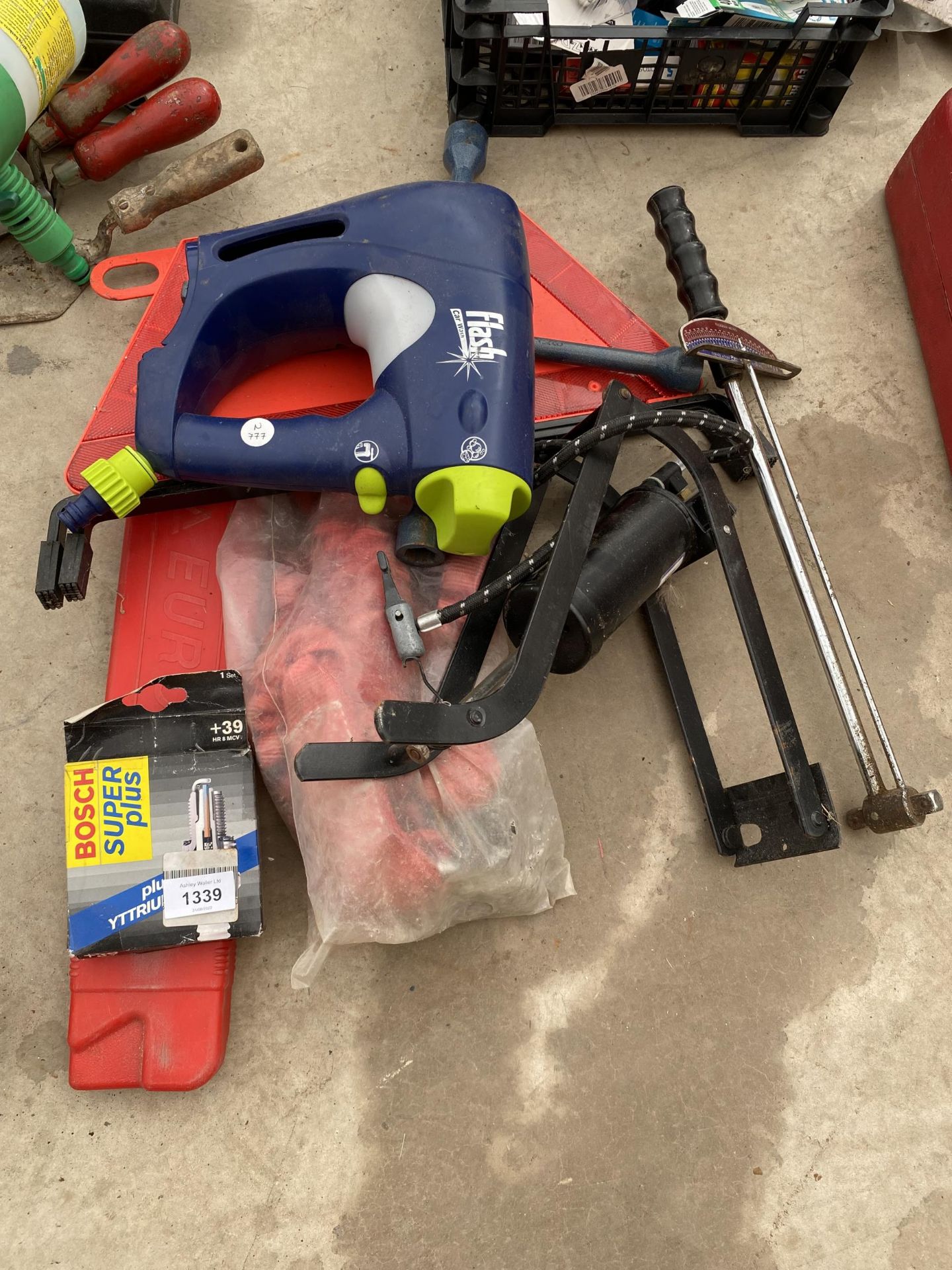 AN ASSORTMENT OF AUTOMOBILE ITEMS TO INCLUDE SAFETY TRIANGLES, A FOOT PUMP AND A WRENCH ETC