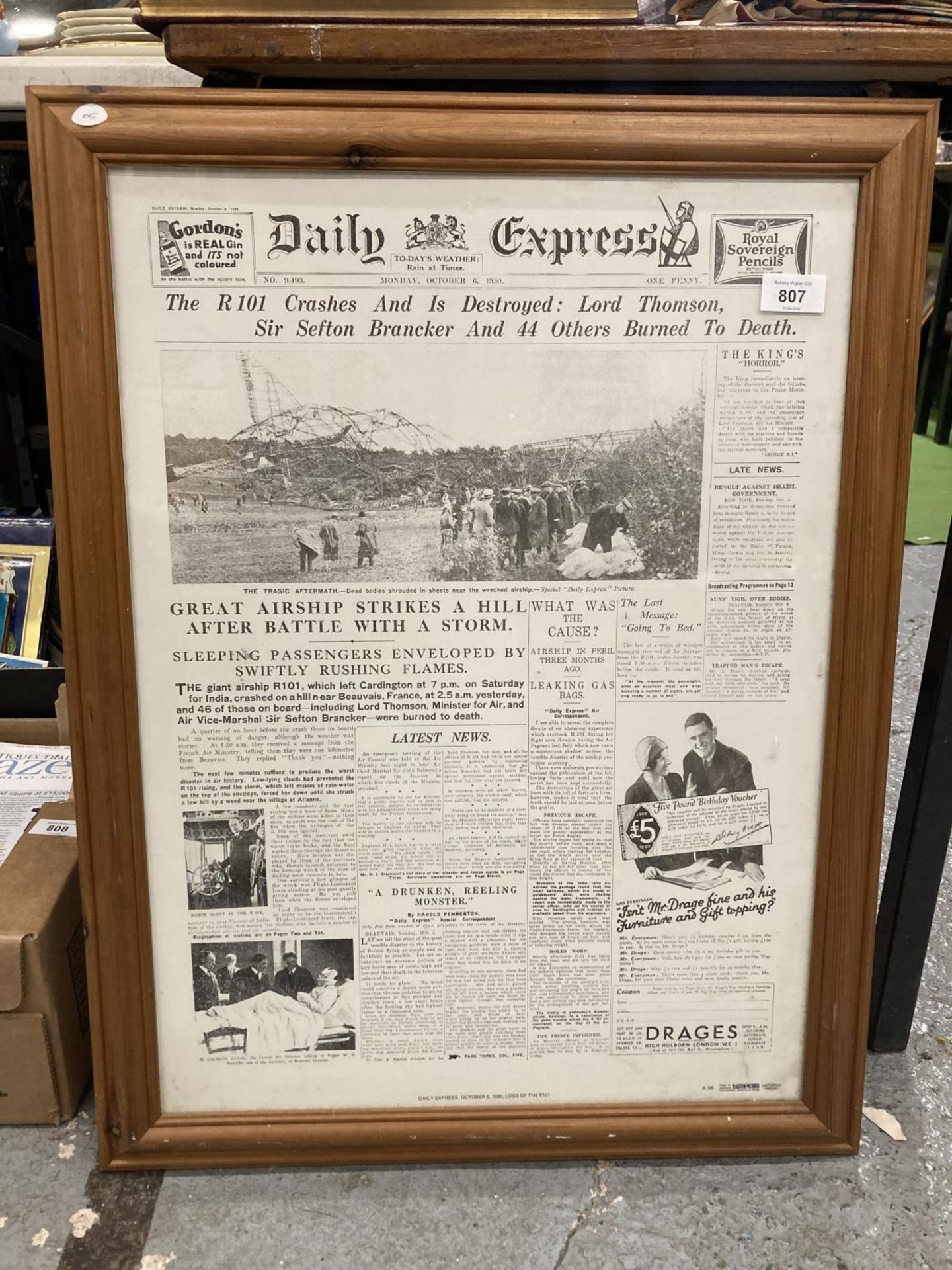 A FRAMED PRINT OF THE FRONT PAGE OF THE DAILY EXPRESS, MONDAY, OCTOBER 6, 1930, WITH THE HEADLINE