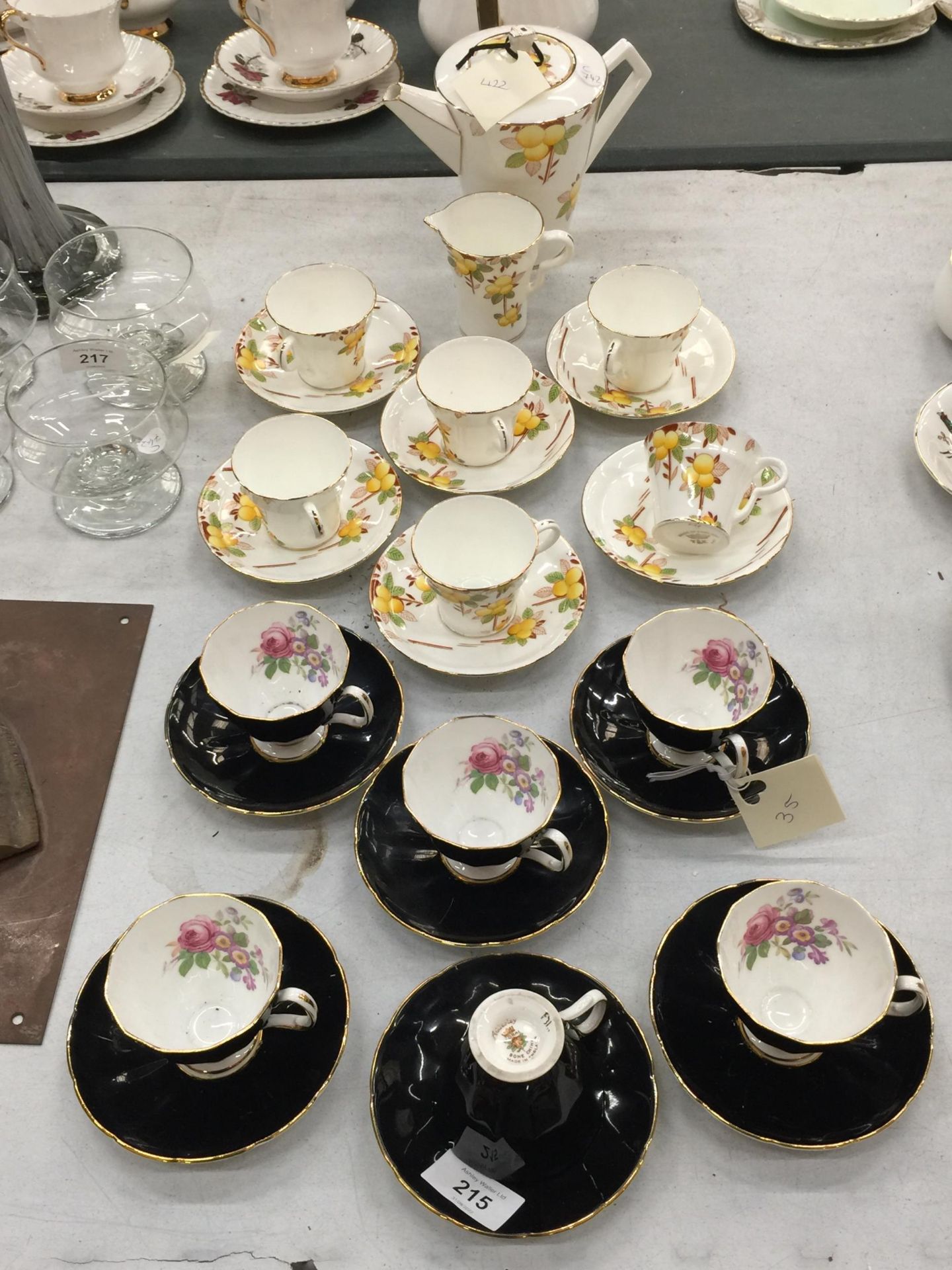 TWO VINTAGE PART TEASETS TO INCLUDE ADDERLEY FLORAL BLACK CUPS AND SAUCERS PLUS ART DECO STYLE