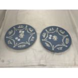 A PAIR OF WEDGWOOD JASPERWARE PLAQUES WITH CHERUBIC DESIGN DIAMETER 23CM