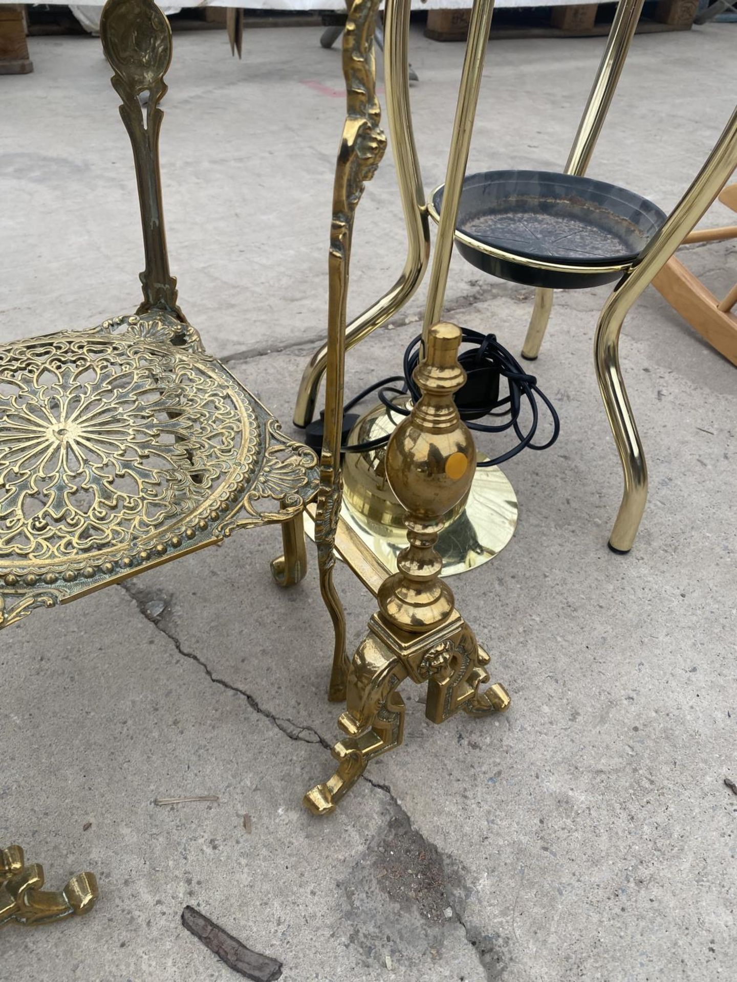 A DECORATIVE BRASS TWO TIER STAND AND A PAIR OF BRASS FIRE DOGS - Image 4 of 4
