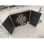 A WINMAU DARTBOARD AND TEAK EFFECT DARTBOARD CUPBOARD