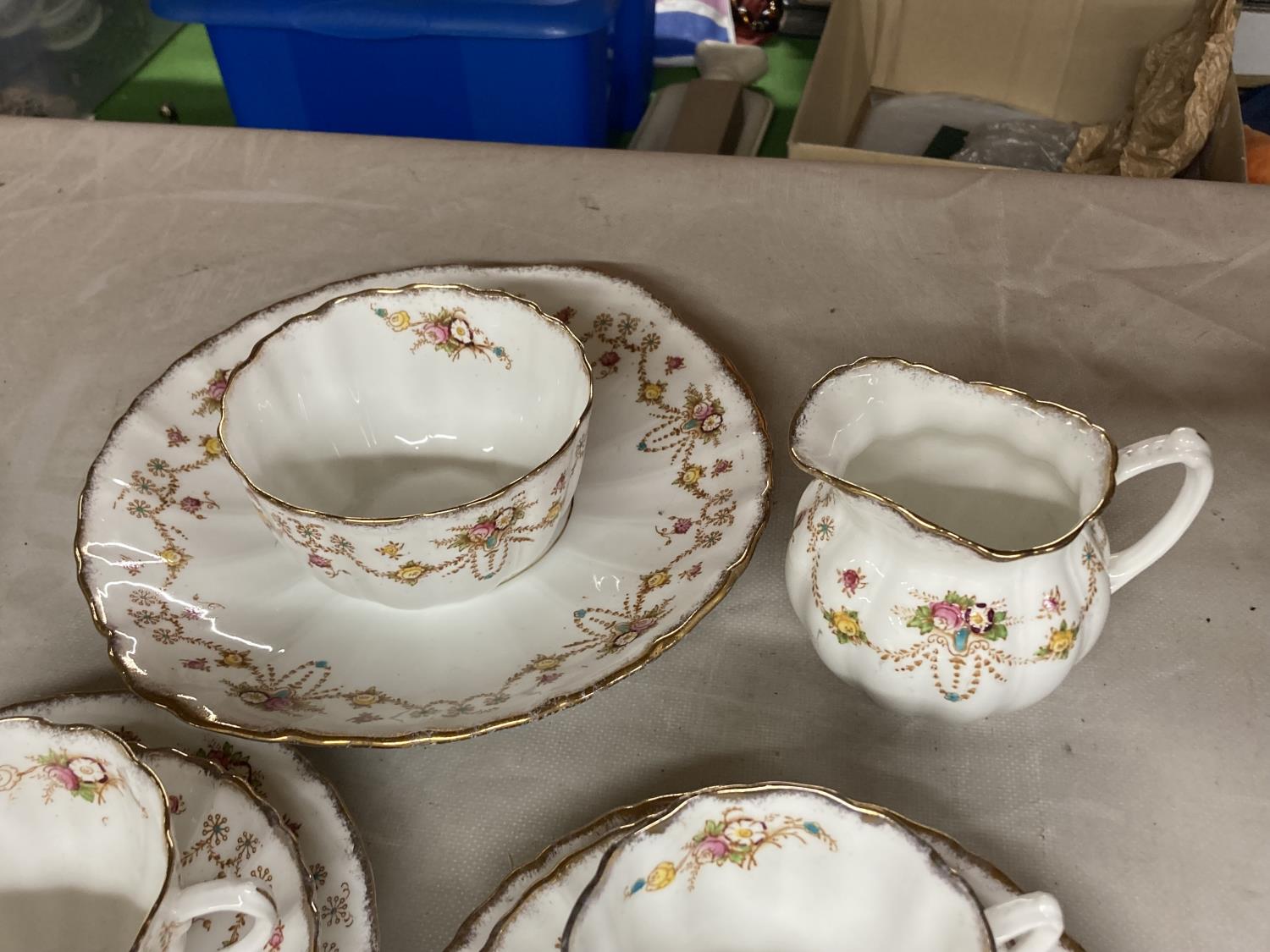 A 'MICHAEL' CHINA TEASET WITH FLORAL SWAG DESIGN TO INCLUDE CAKE PLATE CREAM JUG, SUGAR BOWL, - Image 4 of 5