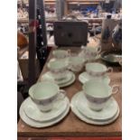 A PARAGON 'MARGOT' CHINA TEASET IN PALE GREEN WITH FLORAL DECORATION TO INCLUDE SUGAR BOWL, CREAM