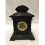 AN ORNATE CHIMING MANTLE CLOCK WITH GERMAN MOVEMENT AND PENDULUM. KEY IS PRESENT AND WORKING AT TIME