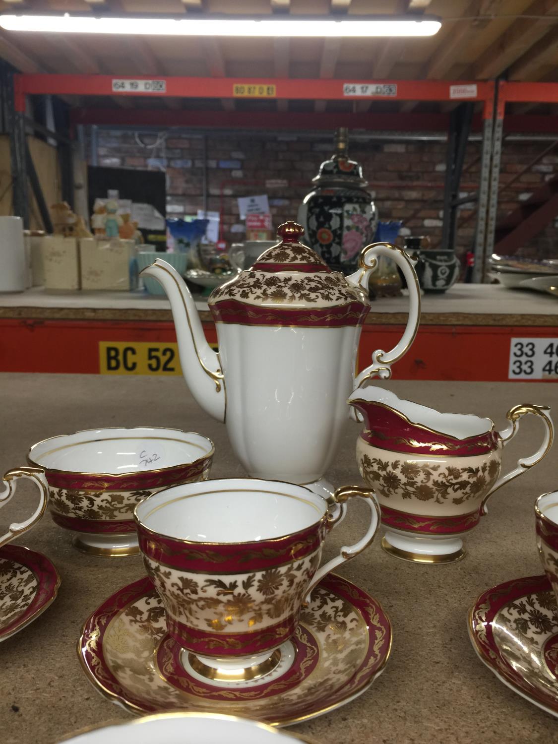 A PARAGON CHINA COFFEE SET IN A CRIMSON AND GILT PATTERN TO INCLUDE A COFFEE POT, CREAM JUG, SUGAR - Image 2 of 4