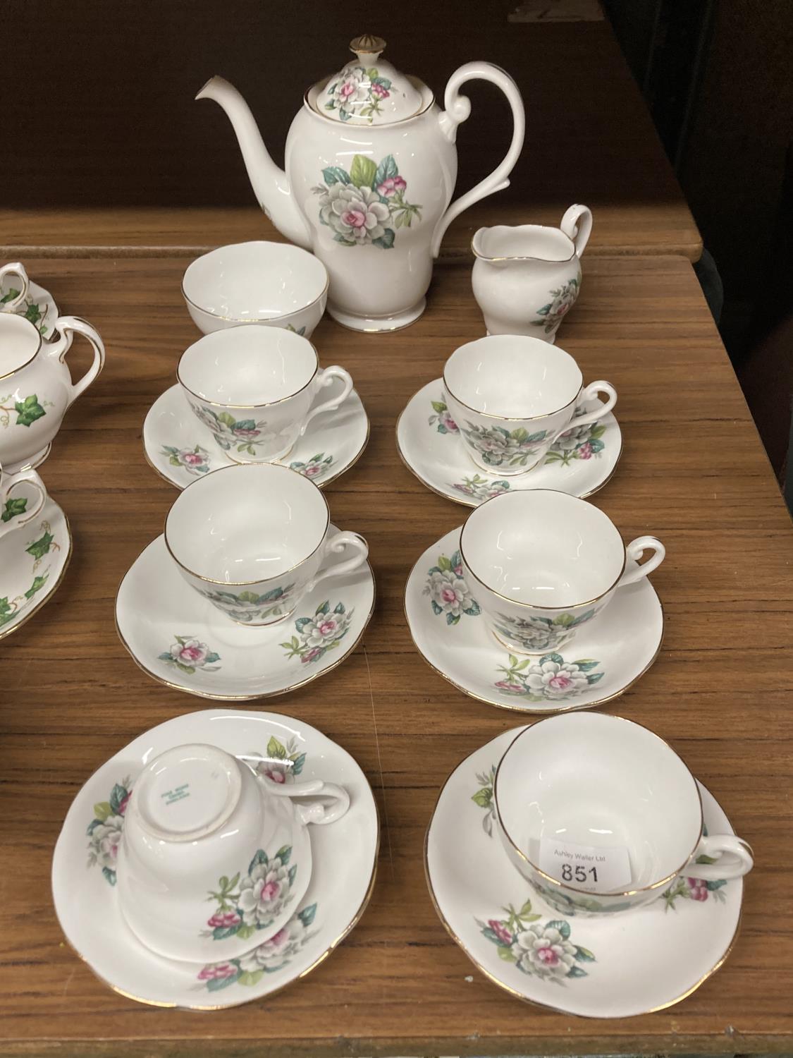 A BONE CHINA COFFEE SET WITH FLORAL DECORATION TO INCLUDE COFFEE SET, CREAM JUG, SUGAR BOWL, CUPS