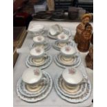 A GLADSTONE CHINA TEASET IN PALE BLUE WITH FLORAL AND GILT DECORATION TO INCLUDE CAKE PLATE, CREAM