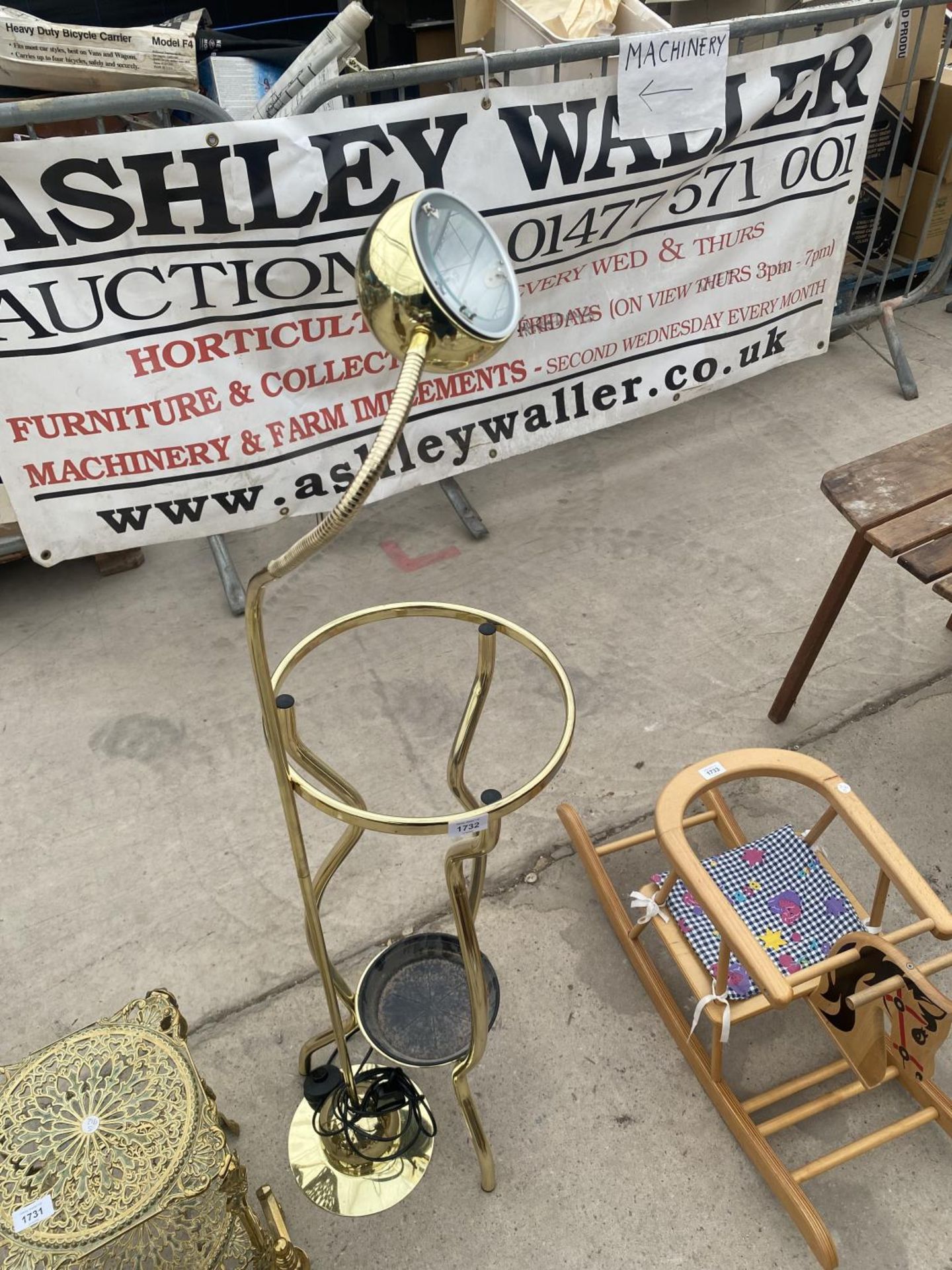 A GILT FLOOR LAMP AND A STICK STAND