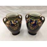 A PAIR OF HAND PAINTED NORITAKE VASES WITH GILT EDGING AND BIRD DESIGN TO FRONT H: 20CM