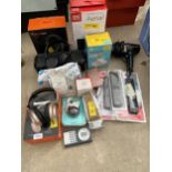 AN ASSORTMENT OF ELECTRICAL ITEMS TO INCLUDE HEADPHONES, A SPEAKER AND REMOTE CONTROLS ETC