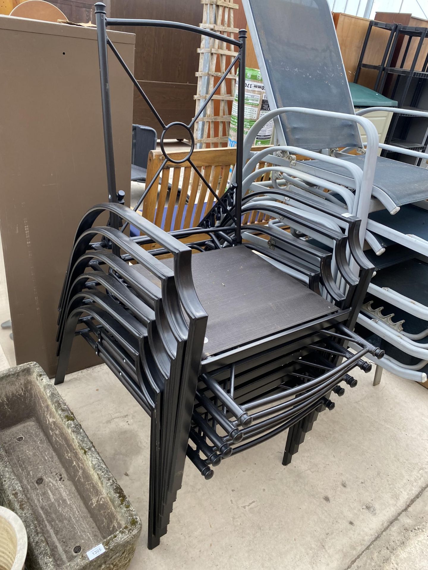 A SET OF SIX BLACK METAL STACKING GARDEN CHAIRS