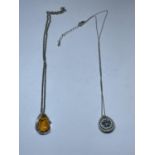TWO MARKED SILVER NECKLACES WITH PENDANTS TO INCLUDE AN AMBER STYLE DROP AND A BLUE AND CLEAR STONE