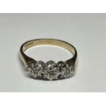 A 9 CARAT GOLD RING WITH THREE IN LINE DIAMONDS SIZE P