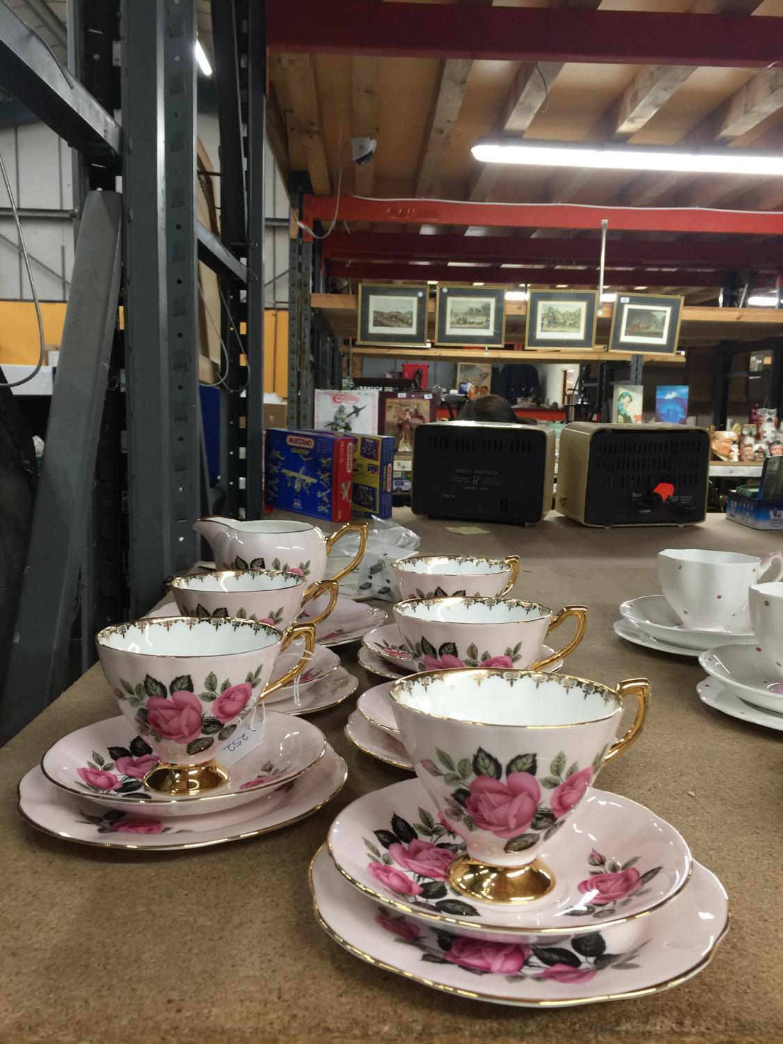 A KENT CHINA TEASET IN A PALE PINK WITH ROSE DESIGN TO INCLUDE CAKE PLATE, CREAM JUG, SUGAR BOWL,