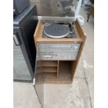 A MEDIA CABINET WITH BELT DRIVEN RECORD PLAYER AND FIDELITY STEREO SYSTEM