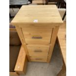 A PINE THREE DRAWER FILING CABINET