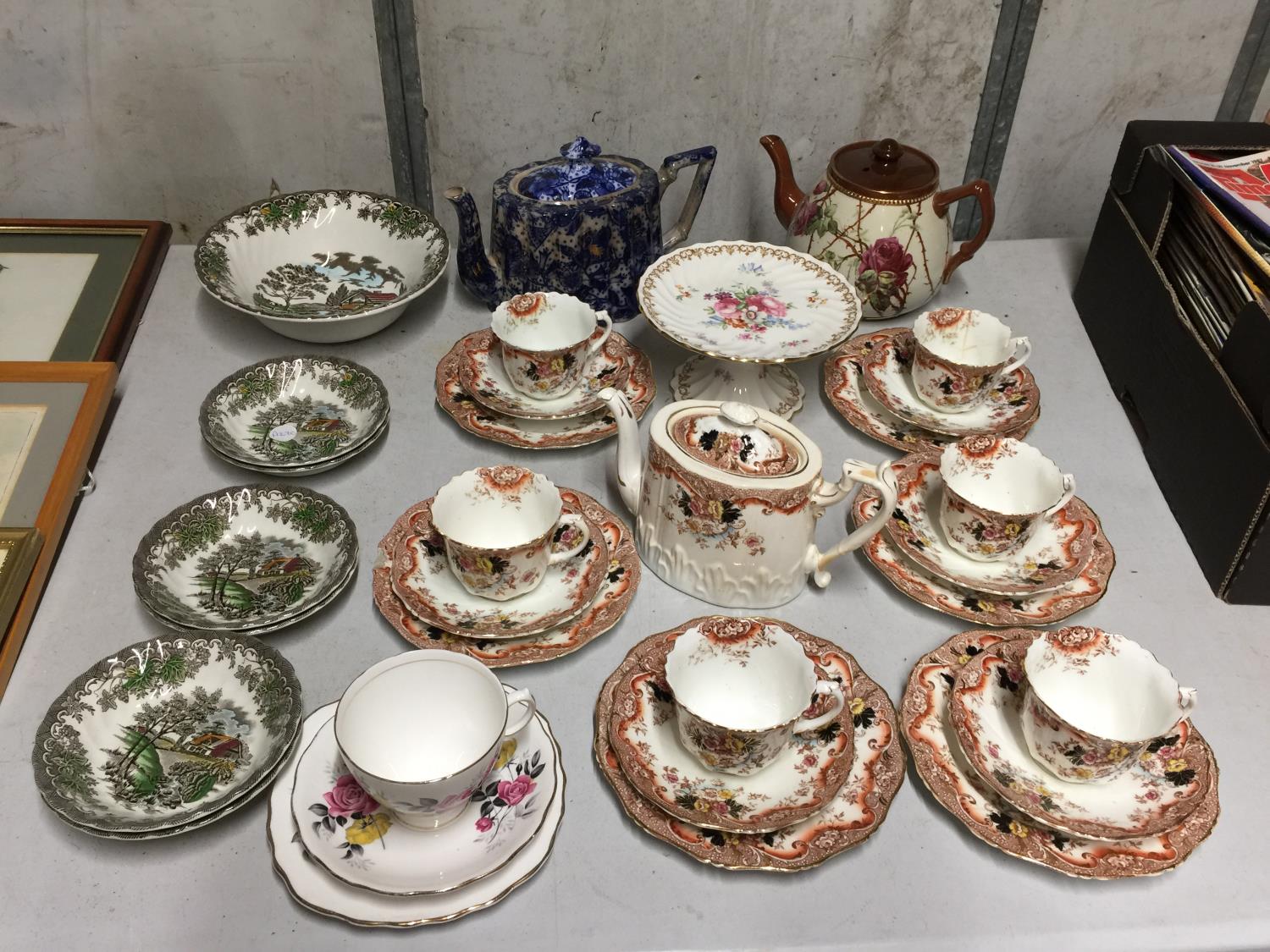 A CHINA TEASET TO INCLUDE A TEAPOT, CUPS, SAUCERS, SIDE PLATES, A JAPANESE BLUE AND WHITE TEAPOT,