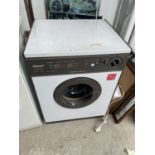 A WHITE AND BROWN HOTPOINT REVERSOMATIC DRYER
