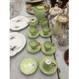 A CARLTON WARE HANDPAINTED RETRO COFFEE SET IN LIME GREEN WITH GILDING TO INCLUDE COFFEE POT,