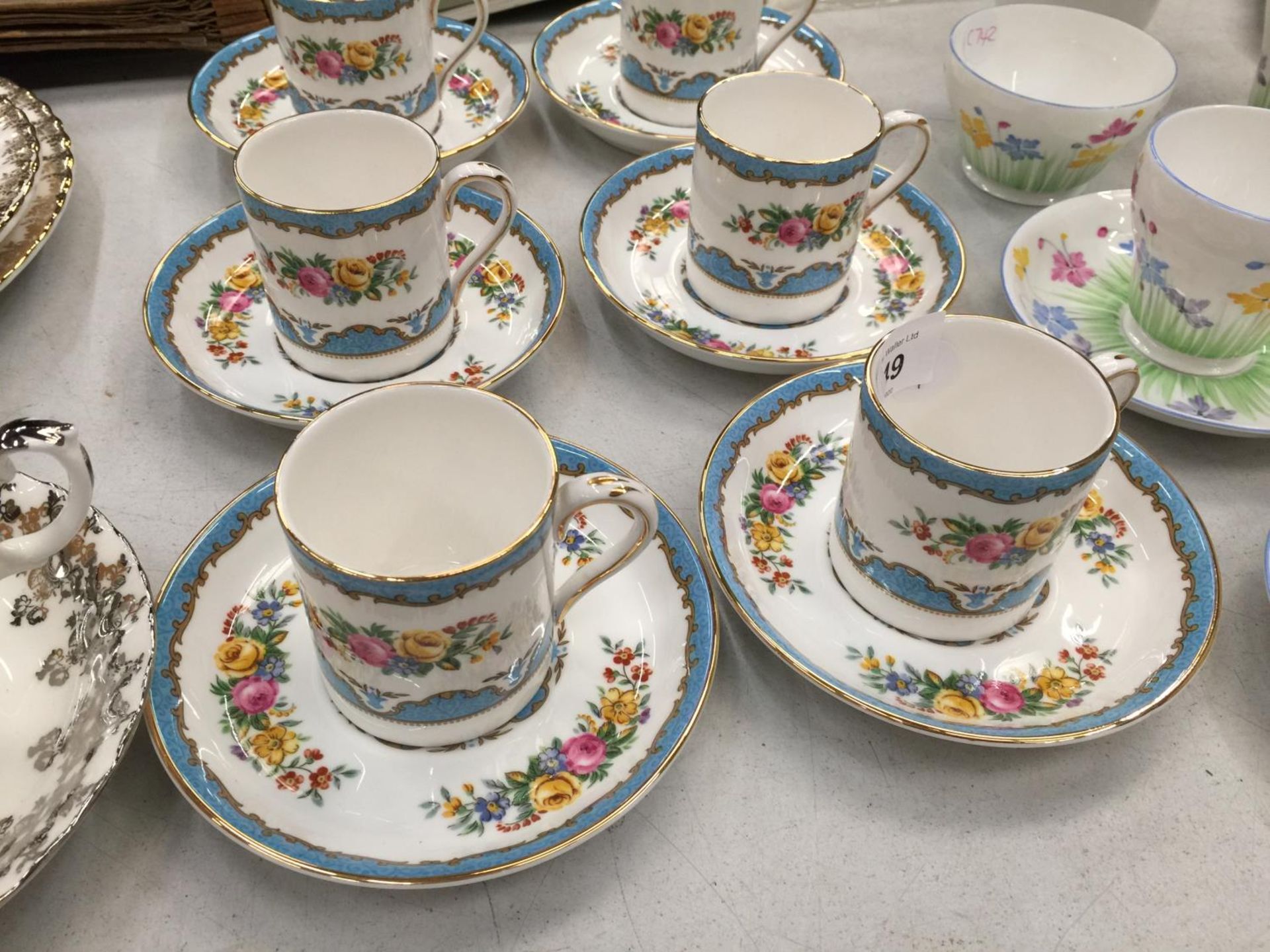 A SET OF SIX CROWN STAFFORDSHIRE CHINA DEMI-TASSE COFFEE CANS AND SAUCERS WITH A FLORAL PATTERN - Image 2 of 3