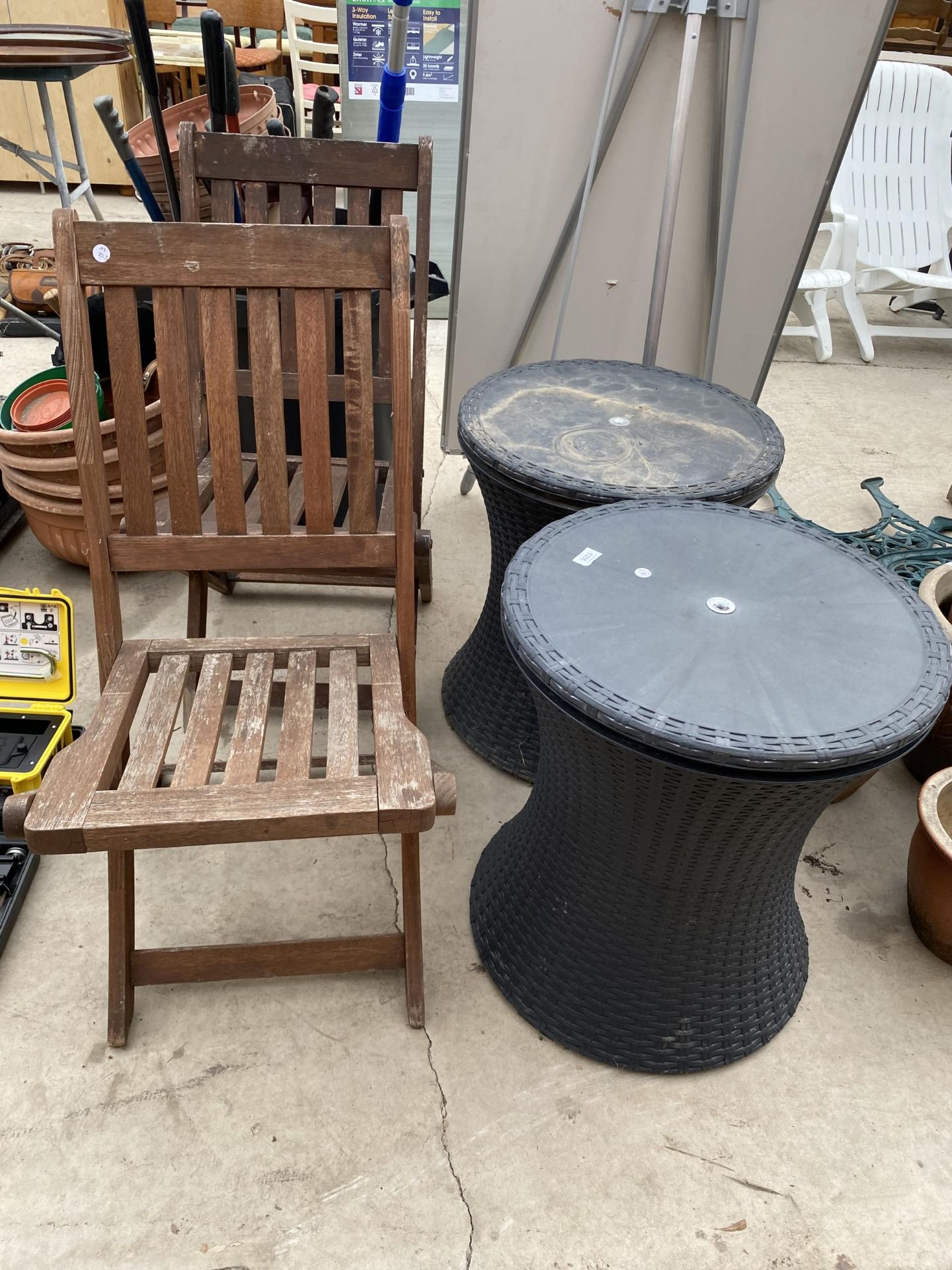 TWO FOLDING TEAK GARDEN CHAIRS AND TWO RATTAN TABLES WITH STORAGE