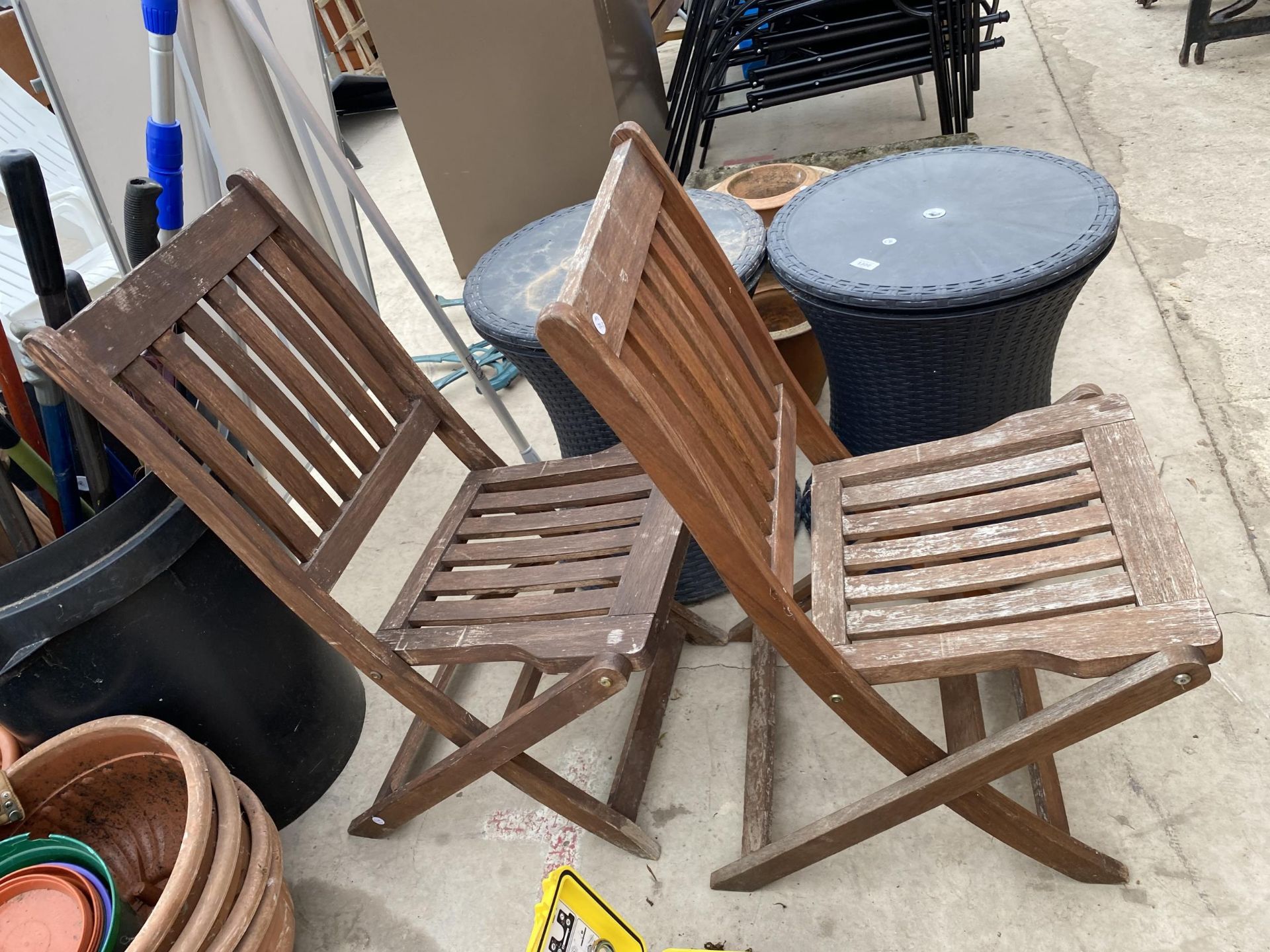 TWO FOLDING TEAK GARDEN CHAIRS AND TWO RATTAN TABLES WITH STORAGE - Image 2 of 3