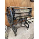 A VINTAGE CAST IRON AND WOODEN MANGLE