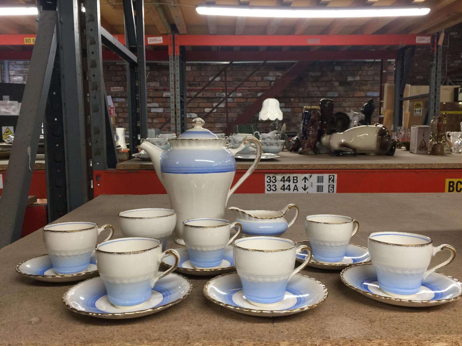 A VINTAGE J & G MEAKIN COFFEE SET IN PALE BLUE AND CREAM TO INCLUDE COFFEE POT, CREAM JUG, SUGAR