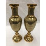 A PAIR OF HEAVY BRASS INDIAN STYLE VASES WITH ETCHED FLORAL LEAF DESIGN H: 45CM